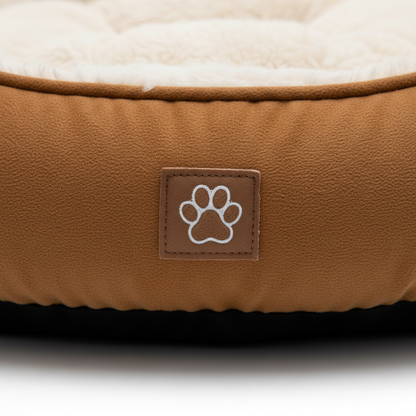Close-up of caramel brown suede fabric and paw badge
